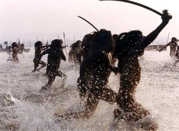 Warlike Indian monks bathe during the Kumbha Mela religious festival.